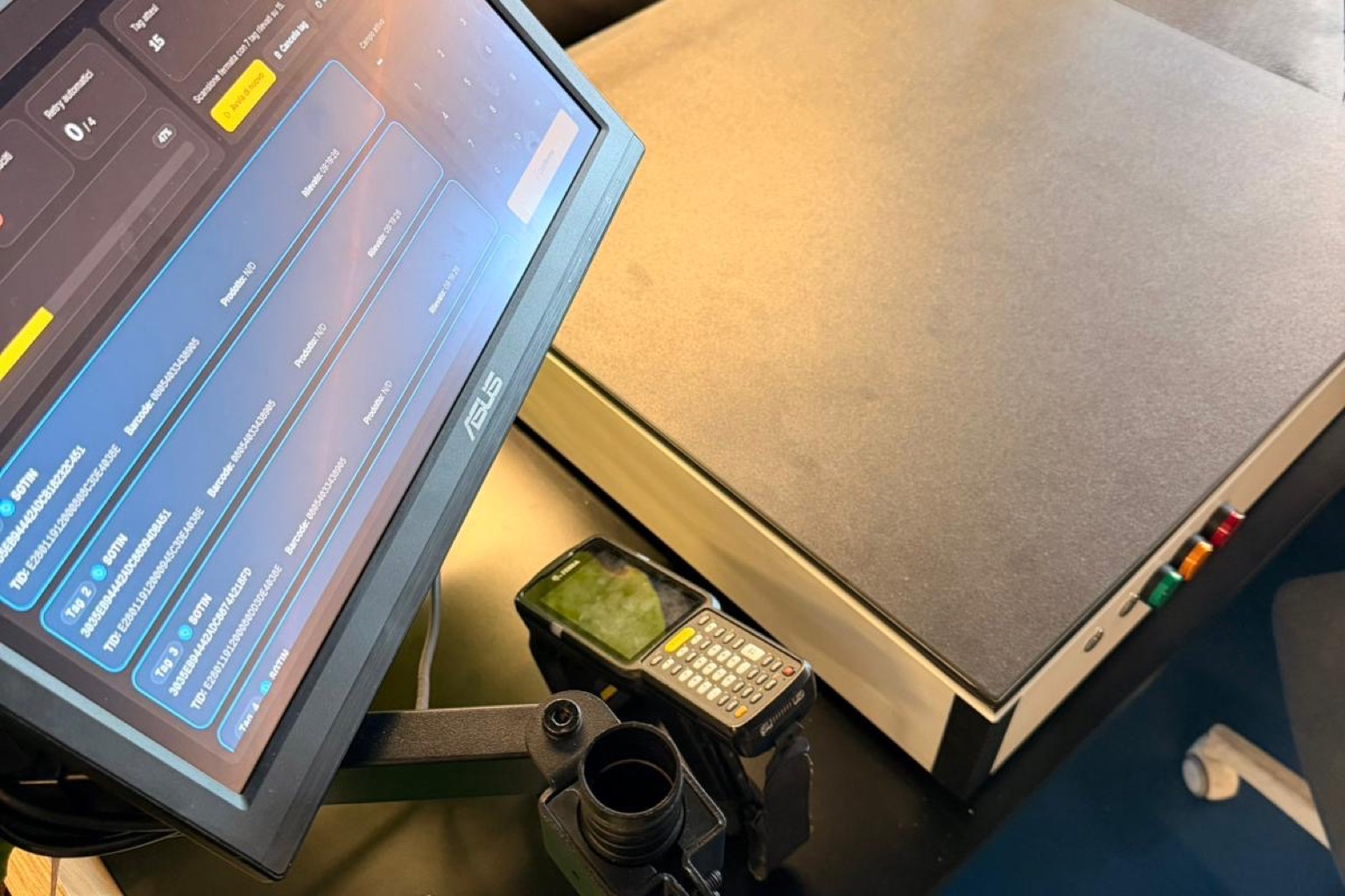 Operator reworking a garment with a defective RFID tag at the workstation